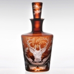 Forest Folly Stag Decanter With a stylish modern twist on a classic theme, the Forest Folly Collection pays homage to the centuries-old tradition of hunting in the Bohemian countryside. The Forest Folly Collection is comprised of six different hunting-themed motifs – Stag, Hare, Fox, Duck, Wild Boar, and Labrador with Pheasant – which are available either individually or as a set of six glasses (sets include one glass with each animal design) in a range of vibrant colors.

Each rustically elegant mouth-blown glass features a hand-engraved image of an animal surrounded by a delicately intertwined thicket of oak branches and centered above a crossed pair of hunting rifles, as well as a single oak leaf on the bottom. Inspired by an Art Nouveau engraving of a fierce stag that ARTĚL founder/director Karen Feldman found in her country house in southern Bohemia, the Forest Folly collection is perfect for a country house or hunting lodge, and the set of six glasses makes a great conversation piece at any occasion where game is served. Forest Folly was created by Věra Panková, ARTĚL’s longtime design collaborator.