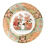 Imari Accent Regency Flowers Accent Plate Part of a larger collection of Imari inspired Accent plates and coordinating cups and saucers, the Regency Flowers Plate displays a mixed color palette of flora and fauna in baby blues, greens and oranges finished in hand applied 22 carat gold.