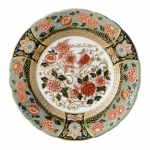 Imari Accent Riverside Park Accent Plate Part of a larger collection of Imari inspired Accent plates and coordinating cups and saucers, the Riverside Park Plate displays a muted red and blue colour palette of flora and fauna finished with hand applied 22 carat gold. 