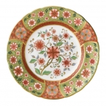 Imari Accent Cherry Blossom Accent Plate Part of a larger collection of Imari inspired Accent plates and coordinating cups and saucers, the Cherry Blossom Plate displays a muted green and red colour palette of flora and fauna finished with hand applied 22 carat gold. 