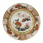Imari Accent Imperial Garden Accent Plate Part of a larger collection of Imari inspired Accent plates and coordinating cups and saucers, the Imperial Garden Plate displays a bold red and black color palette of flora and fauna finished with hand applied 22 carat gold. 