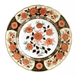Imari Accent Antique Chrysanthemum Accent Plate Part of a larger collection of Imari inspired Accent plates and coordinating cups and saucers, the Antique Chrysanthemum Plate displays a black, cream and orange color palette of flora and fauna finished with hand applied 22 carat gold. 