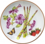 Summerlea Asparagus and Petunia Bread and Butter Plate Julie Wear gathers ordinary fruits and vegetables from the garden and combines them together in unexpected ways to create a pattern of delightful color and movement. 