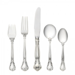 Chantilly Sterling Five Piece Place Setting with Cream Soup Spoon Finely crafted with the graceful elegance associated with 18th Century France, this stately pattern was first introduced in 1895. The intricate design is embellished with a cascade of deeply carved borders showcasing a slender raised central panel along the handle and a more substantial open panel that can be monogrammed near the tip, which is crowned with a delicate fleur de lis. A stunning addition to traditional and formal interiors, this regal pattern will turn every meal into an event.

Polish your sterling silver once or twice a year, whether or not it has been used regularly. Hand wash and dry immediately with a chamois or soft cotton cloth to avoid spotting.
