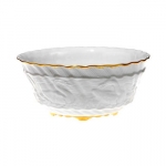 Swan Service Gold Filet Bowl The history of porcelain manufacturing in Europe begins in Meissen, Germany near Dresden, the cradle of European porcelain. Apart from the short-lived production of the Medici factory in Florence in the 1560\'s, Meissen was the first successful producer of hard-paste porcelain - or true porcelain - in Europe. Meissen\'s products, and those of its imitators, who came later, destroyed the supremacy of the oriental porcelain that had held a virtual monopoly in the world since Marco Polo opened the china trade in 1295. 
In the 17th and 18th centuries porcelain was viewed as a great luxury in Europe. Court society longed for everything rare, which porcelain was. It became the fashion for northern European rulers to install a porcelain room where every inch was covered by porcelain. Just as in our time, the ownership of such precious things demonstrated wealth, luxury, and culture.
 
Before Meissen discovered how to produce it, porcelain was being imported from China by the East Indian Company (thus, the term chinaware). The European countries\' desire for porcelain was so great it was causing them troubling trade gaps. To arrest this disastrous outflow of monies, European rulers were frantically trying to find out how to make this chinaware themselves. Nowhere was this search more intense than in Saxony in eastern Germany. 

Augustus the Strong, Elector of Saxony and King of Poland (who reigned from about 1693 to 1733), was obsessed with a passion for porcelain. He had heard of a young alchemist, Johann Frederick Bottger, who had worked for Frederick I of Prussia, having boasted that he could turn base metal into gold. Proving unsuccessful in this process, Bottger fled Berlin to Saxony (he was only about 20 years old at this time), where he was immediately imprisoned by Augustus. Augustus felt if Bottger could produce gold, he could also produce porcelain-or \white gold\ as it was called then.

In 1709, aided by the discovery of deposits of Kaolin (china clay) nearby, Bottger informed Augustus that he had discovered the arcanum-the secret ingredients of porcelain. In 1710 Augustus decreed the founding of his manufactory and transferred Bottger and his helpers to the royal summer palace in Meissen. Augustus continued to hold them prisoners in the palace in order to protect the Arcanum. Meissen was able to protect this secret for years before workmen escaped with their knowledge of porcelain making, and wholesale copying of Meissen across the western world began.

Bottger died in 1719,  and a year later Johann Gregorius Horoldt began work at Meissen, which he took to a whole new level when he invented and manufactured many brilliant Meissen paint colors, as well as introducing many of the decorations typical of Meissen.  In 1730, influenced greatly by the East Indian wares, Meissen created its first Red Dragon pattern. Augustus commissioned the first complete dinner service for his court dining room, thus giving this pattern its name of \court dragon\. This pattern remained in the sole preserve of the Saxon royal family until 1918, when the first world war ended Saxon royalty. By 1739, under Horoldt\'s direction, the mastering of cobalt blue underglaze color was such that the blue-white decorations (such as Blue Onion) could be manufactured. 
In 1730, Horoldt was joined by a 24 year old court sculptor, Johann Joachim Kaendler. Augustus, impressed by his work, had ordered Kaendler to join the Meissen manufactory.   Augustus proved himself to have a good eye, for J.J. Kandler turned out to be, perhaps, the greatest porcelain modeler of all time. One of his greatest works, the Swan Service, was commissioned by the Saxon Prime Minister, Heinrich Count Von Bruhl, and was produced between 1735 and 1741.  It consisted of over 2000 pieces, and was the most extensive service ever made. Many of these pieces will never be produced again, as the occupying forces used the moulds for target practice during the Second World War.  Nevertheless, Meissen continues to create a number of these extraordinary pieces today.

Meissen is as famous for its figurines as for its table services. The members of the royal court used figurines for table decorations, much as people do today. Kaendler\'s talent is known to every connoisseur of porcelain today. In 1734, Kaendler produced the now famous pug dog. These dogs happened to be Prime Minister Count Bruhl\'s favorite dogs, and Kaendler captured their charm with great skill. Indeed, centuries later, the Duchess of Windsor collected these pieces. Kaendler also created the Italian Comedy, composed of a wide variety of humorous, sad and sympathetic characters. The most frequently depicted and most endearing character is Harlequin. The poses in which Kaendler imagined this one character alone would suffice to establish his greatness as a modeler.

In 1753 Kaendler created 21 charmingly amusing Monkey Musicians, which composed the famous Monkey Orchestra. The story is that Kaendler modeled them after members of the Saxon court, though this cannot be documented. As every piece of Meissen is handpainted by Meissen artisans, each monkey has its own unique touch. The monkey band is one of the most famous of the Meissen figurine collections, and is extremely popular among today\'s collectors.

Kaendler and Hoeroldt both died in 1775, a great loss for the manufactory and the world, but Meissen\'s creativity continued. In 1814 Heinrich Gootlob Kuehn became the managing director, and, three years after his arrival, developed the color chromium-oxide green, resulting in the much loved \Vine Leaves\ pattern being produced. Ten years later, in 1827, Kuehn developed the bright gold, which we take so much for granted today.
 
Fast forward to1889, when Julius Conrad Hentschel began attending Meissen drawing school. His enormous talent did not go unnoticed, and by 1897, after much training, Hentschel became a Meissen designer. Hentschel designed during the Art Nouveau period, and this movement influenced the sculptor in the production of his most famous work, \Hentschel\'s Children,\ fourteen porcelain children created between1904 - 1907. Hentschel captured the changing attitude toward children in the early 1900s. Children were no longer viewed as little adults, but rather as individuals in their own right. Figures of children became more true to life. Cuteness was replaced by everyday childhood realities. Hentschel died quite unexpectedly in 1907, leaving behind his detailed, loving observations of children\'s activities.

The Second World War and its aftermath were difficult years for Meissen. Molds were destroyed and pieces were broken or disappeared. Meissen was instructed to produce wares representing the new meaning of life in a socialist society. This proved nearly impossible for the Meissen manufactory, as designers attempted to conform to these orders, and no one was interested in the objects created under such restrictions. During this period, Meissen had to confront the question as to whether or not it should remain a manufactory, where everything was made by hand and every piece would remain unique with no two pieces exactly alike, or become a factory, where machines mass produced the large numbers required of a factory. It was not until 1969, when the new Director, Karl Peterman, took the helm and returned the freedom to create to the designers, that the original course of Meissen as manufactory again reigned. Once again, Meissen was able to preserve the old traditions, and maintain the high standards of its workers and artists.

In 1960 Professor Heinz Werner (porcelain designer and pattern painter), Ludwig Zepner (designer and modeler), and Peter Strang (sculpturer) became founding members of Meissen\'s new Artistic Development group. Professor Werner\'s best known creations are \Arabian Nights,\ shown in the March, 2005 edition of Elle, and \Blue Orchid.\  Ludwig Zepner designed two new table services \Grosse Ausschnitt\ and \Grosse Ausschnitt Relief\ the most successful Meissen services of the second half of the 20th century. Peter Strang opened a new chapter in the history of Meissen sculpture. His work dominates contemporary Meissen sculpture. Much of Strang\'s work is based on the theater and on circus figures-his clown musicians are loved the world over. Sabine Wachs arrived at Meissen in 1986, and, between1993-1996, created the newest Meissen tableware. This service, called \Waves\ and \Waves Relief,\ is shown in many patterns, one as beautiful as the next. 

In 2000, Meissen visited L. V. Harkness & Company in Lexington, Kentucky. They became enchanted with the Bluegrass region, its legends and its stories, and not long after their visit, created a new pattern, called \Bluegrass\ on the Waves form. This they dedicated to L. V. Harkness to commemorate their visit. It is understandable that we are very proud of such an incredible honor.  L.V. Harkness is also proud to have Meissen create \Jockey Birds\ in honor of Kentucky\'s rich racing heritage. a very unique gift from the rolling hills of Kentucky.

Meissen continues to be one of the finest porcelain manufactories in the world today, and we urge you to view Meissen on our website. 