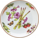 Summerlea Asparagus and Petunia Salad Plate Julie Wear gathers ordinary fruits and vegetables from the garden and combines them together in unexpected ways to create a pattern of delightful color and movement. 